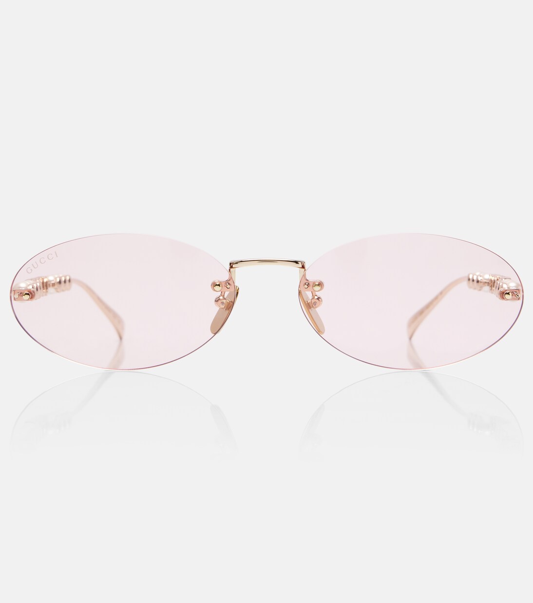 Logo embellished oval sunglasses | Gucci