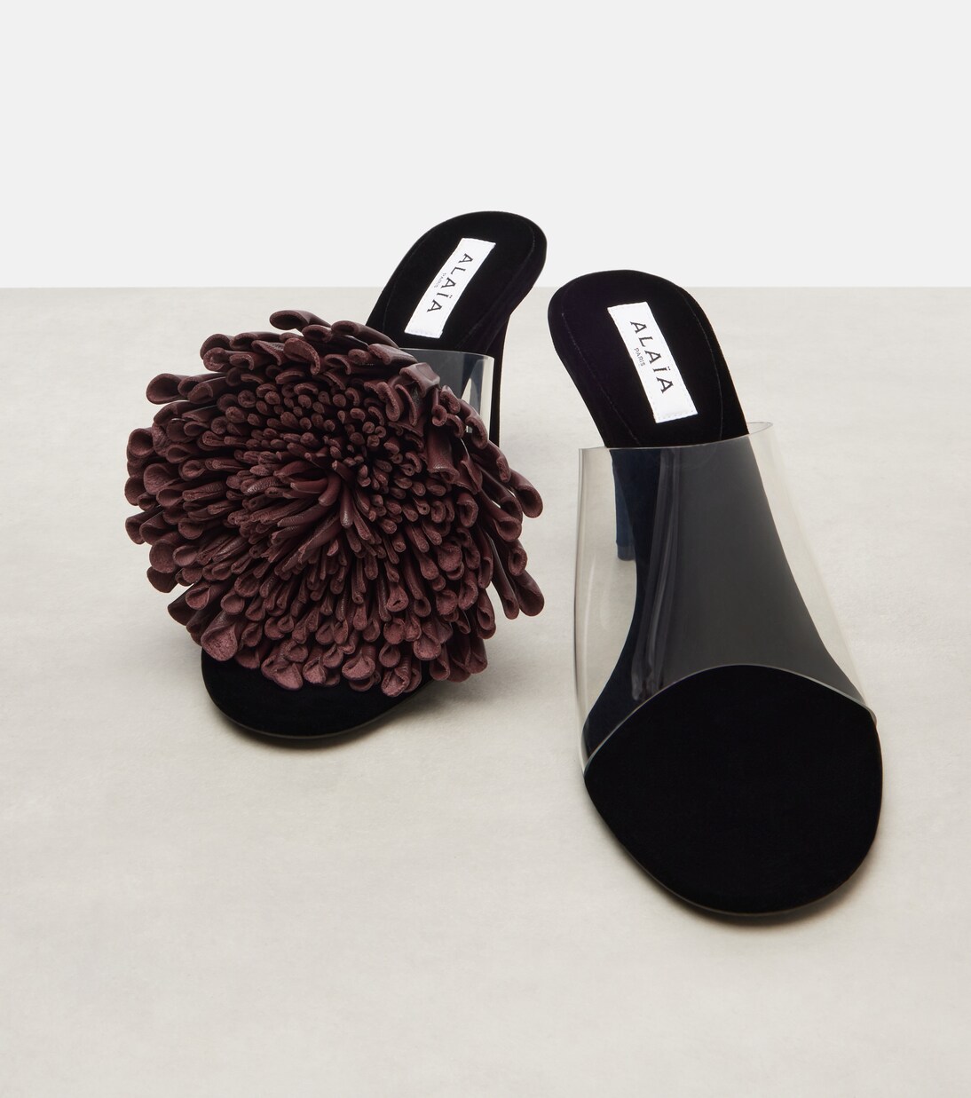 Floral-appliqué asymmetric mules | Alaïa