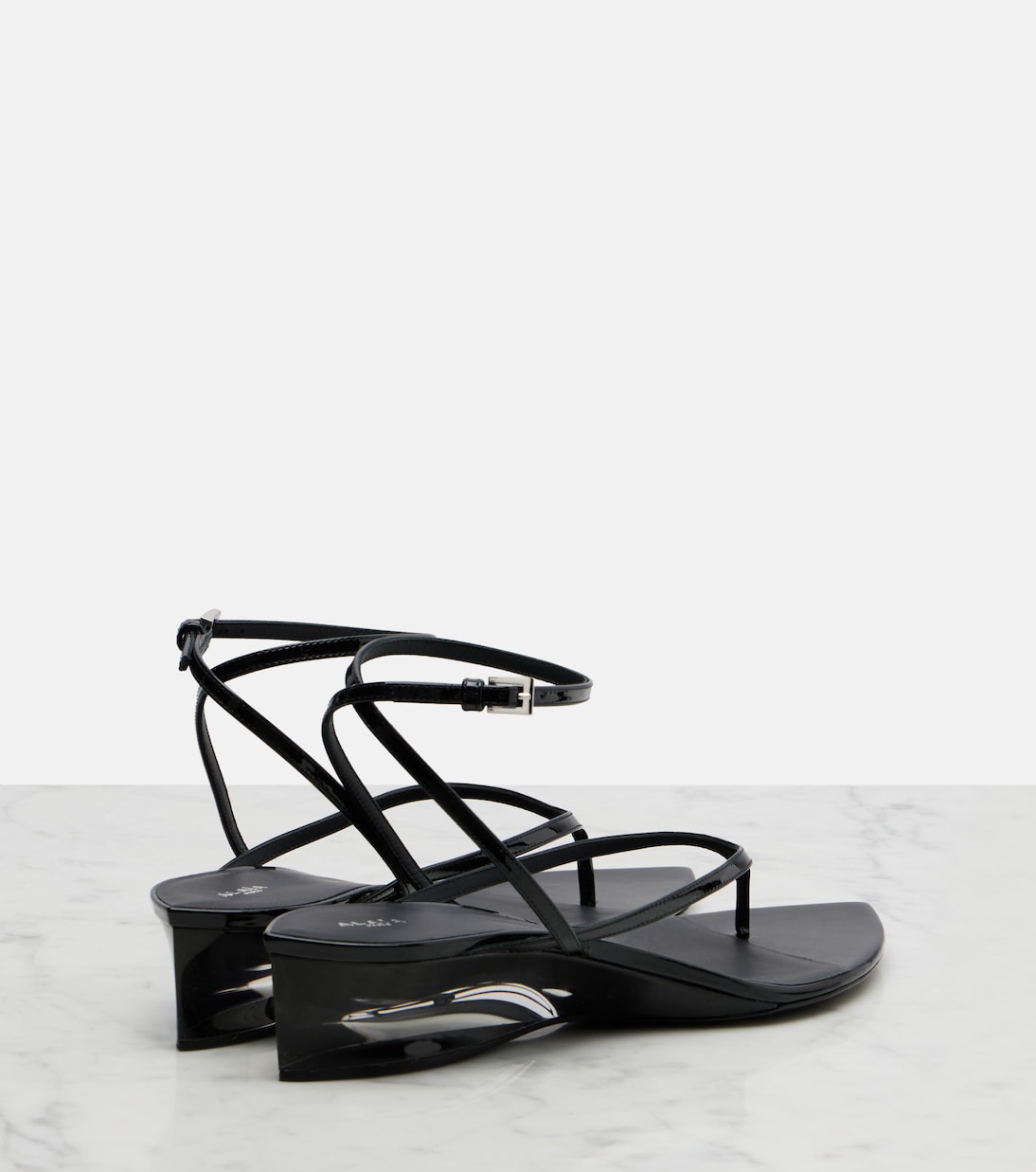 Invisible patent leather thong sandals | Alaïa