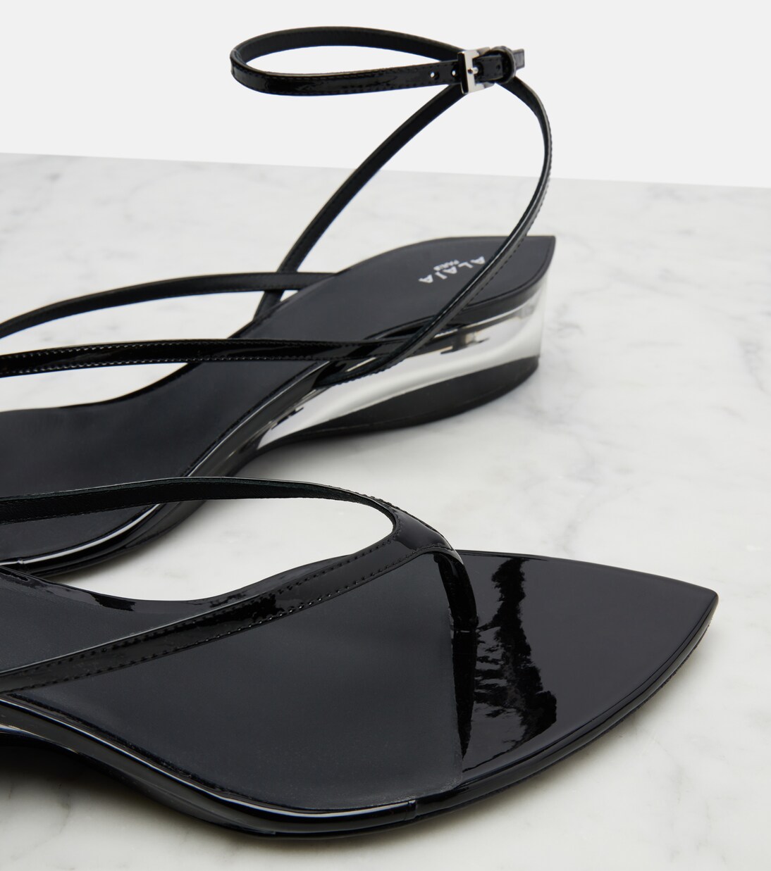 Invisible patent leather thong sandals | Alaïa