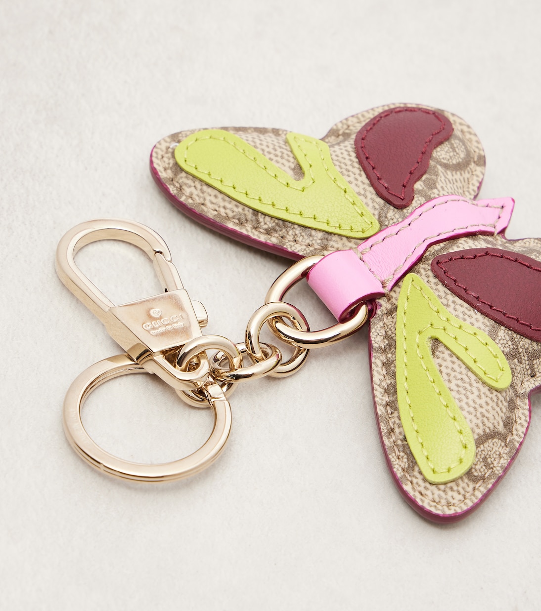 GG leather-trimmed coated canvas bag charm | Gucci