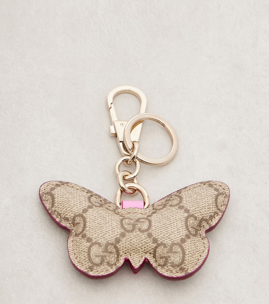 GG leather-trimmed coated canvas bag charm | Gucci