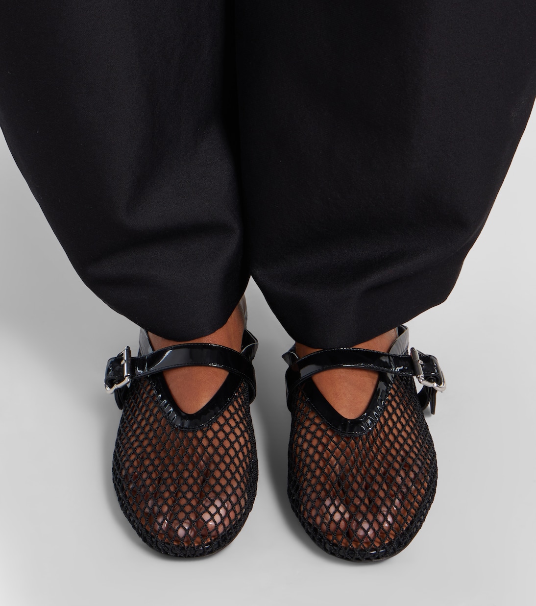 Fishnet leather-trimmed mules | Alaïa