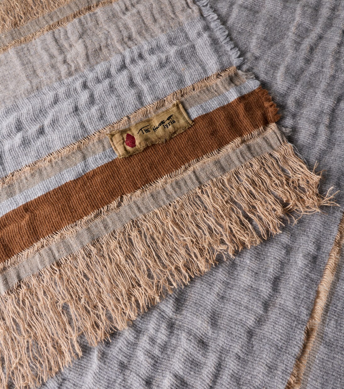 Xoroi striped jute and wool-blend throw | The House of Lyria