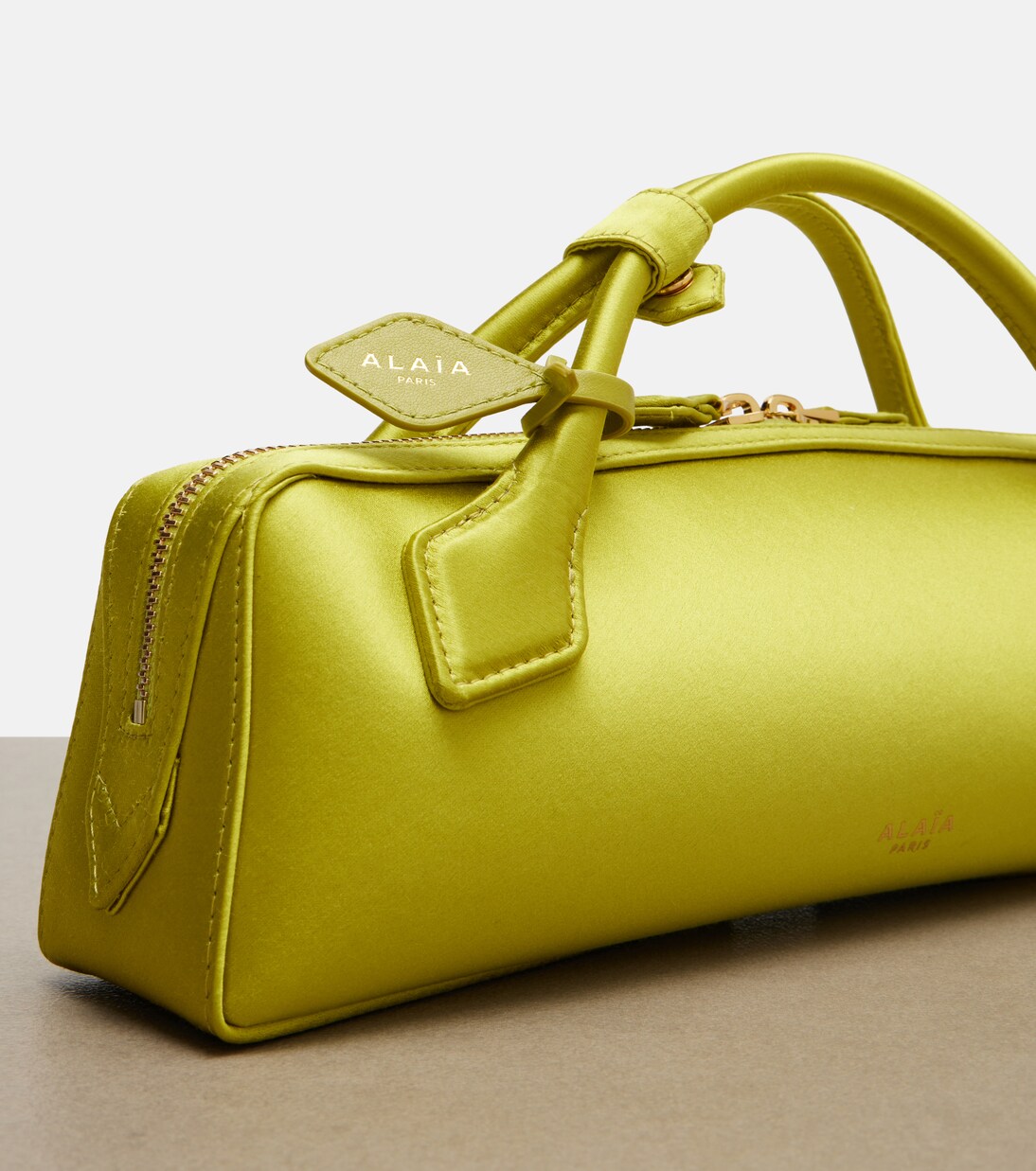 Le Teckel Small satin clutch | Alaïa