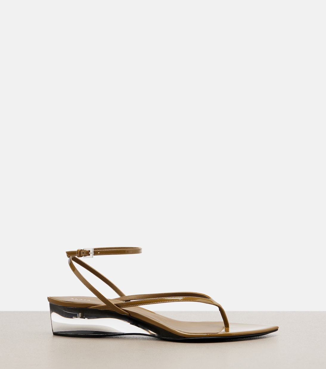 Invisible patent leather wedge thong sandals | Alaïa