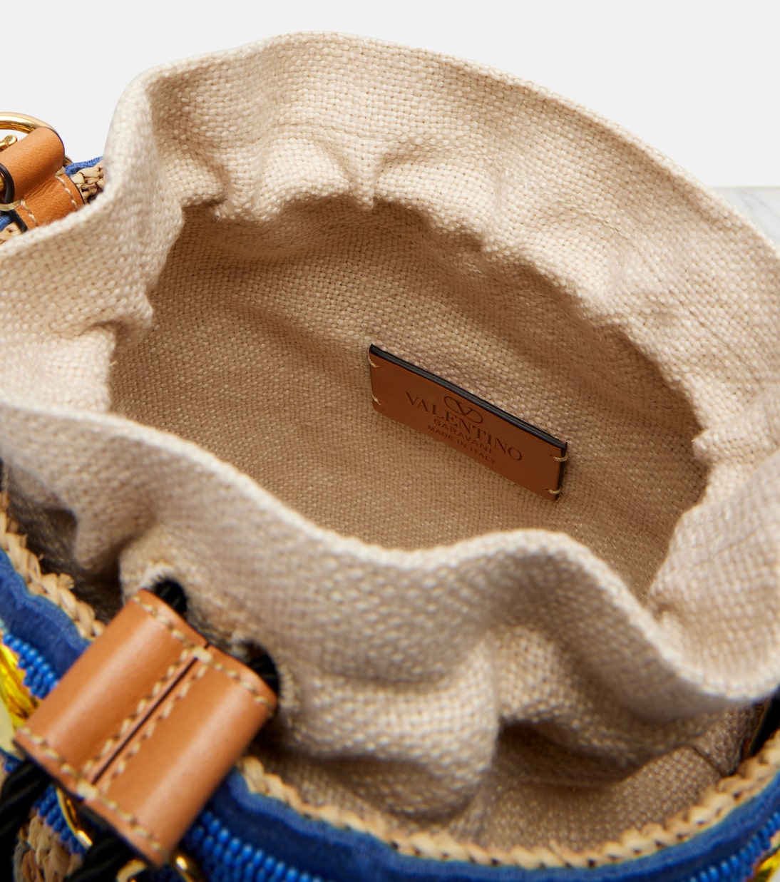 VLogo Small embellished raffia-effect bucket bag | Valentino Garavani