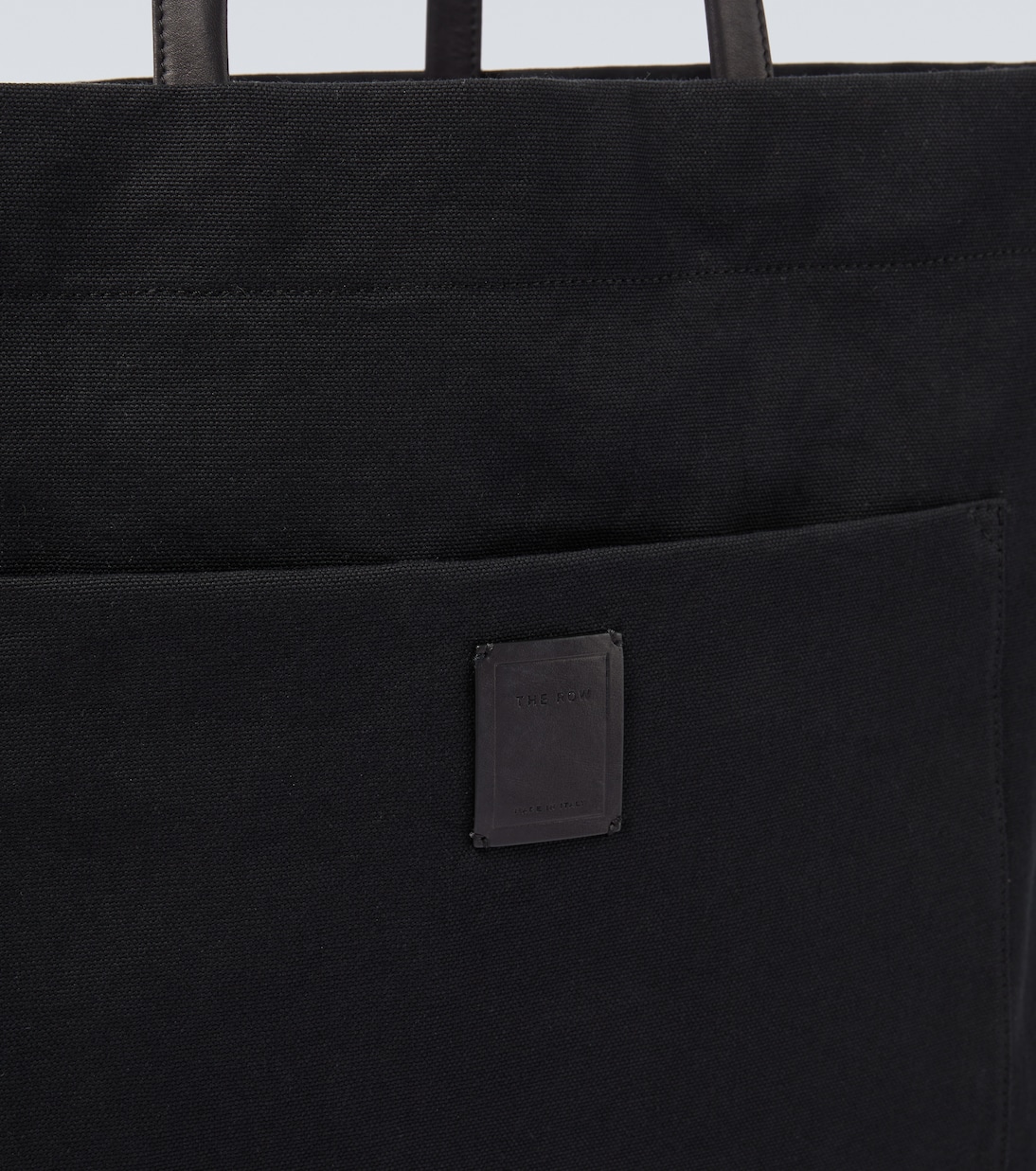 Tori leather-trimmed canvas tote bag | The Row
