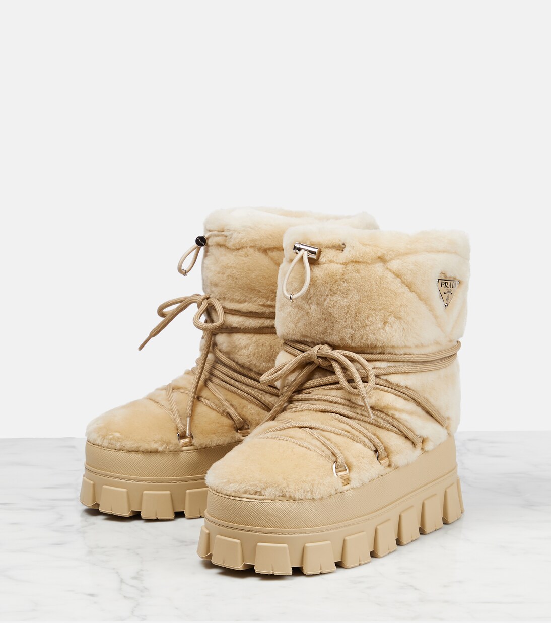 Shearling and leather snow boots | Prada