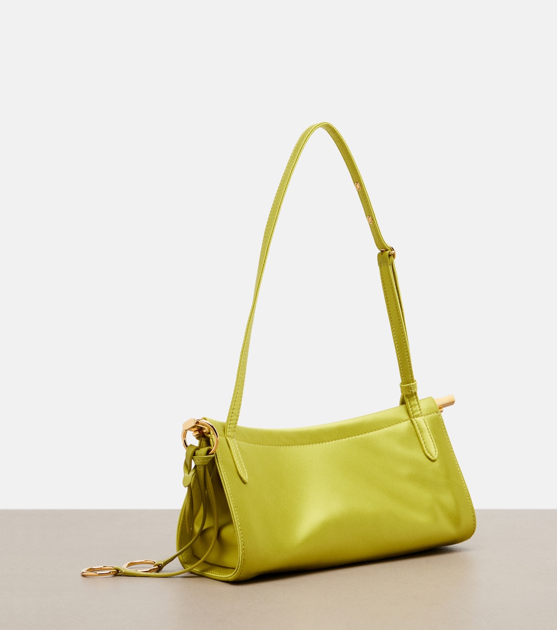 Le Click East West Small leather-trimmed satin shoulder bag | Alaïa