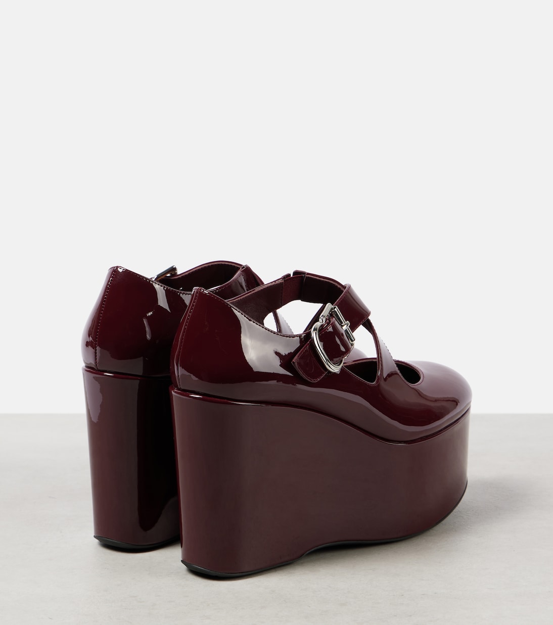 Pumps Criss Cross 110 in vernice con zeppa | Alaïa