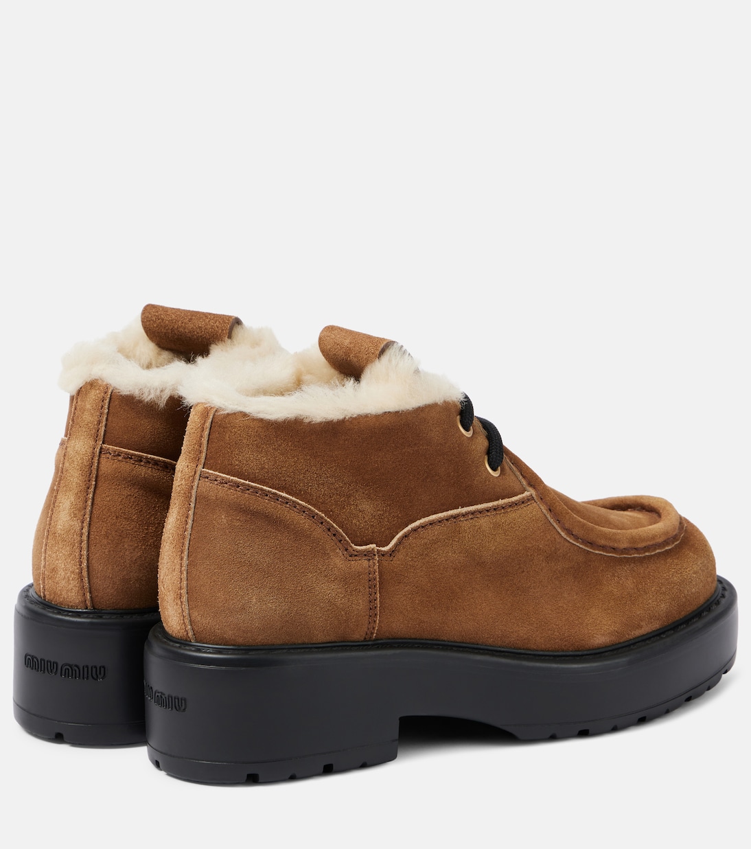 Chunky shearling-trimmed leather flats | Miu Miu
