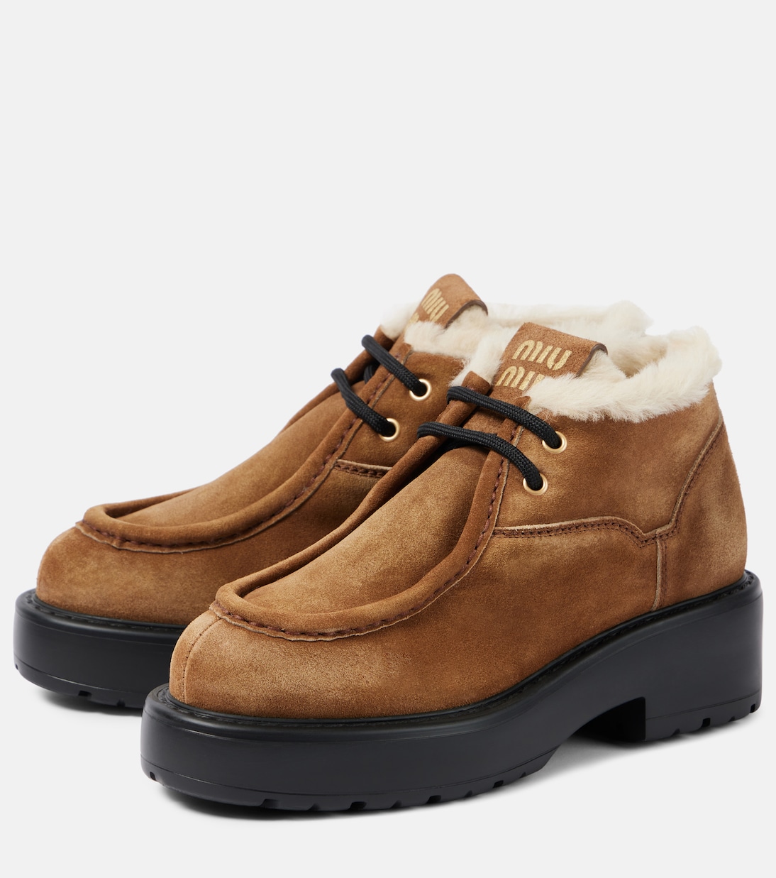 Chunky shearling-trimmed leather flats | Miu Miu