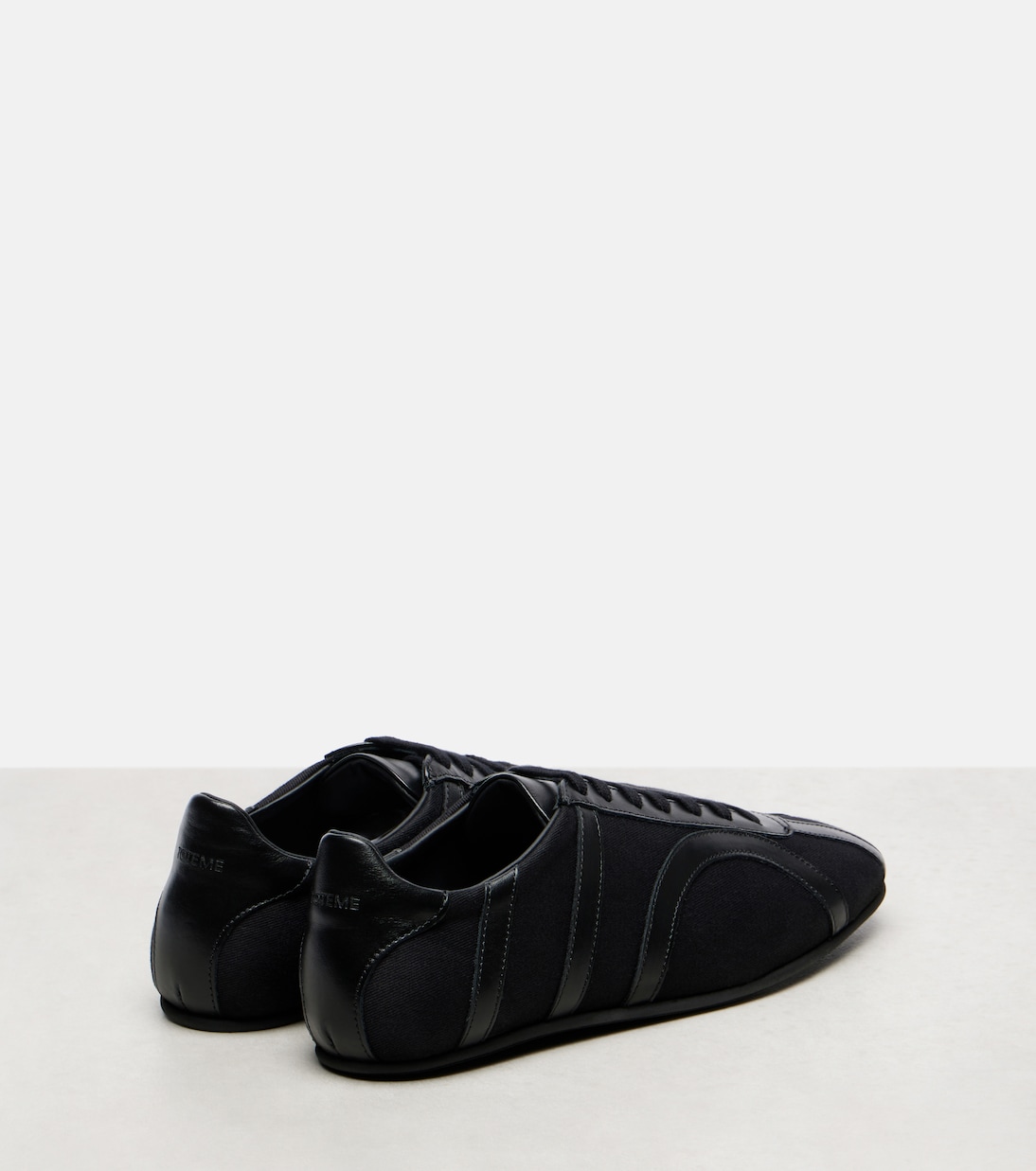 Leather-trimmed sneakers | Toteme