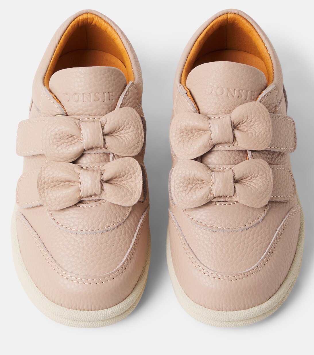 Loena bow-detail leather sneakers | Donsje
