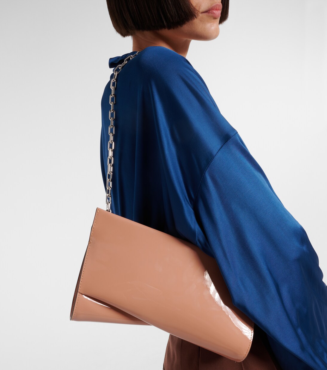 Loubitwist Small patent leather clutch | Christian Louboutin