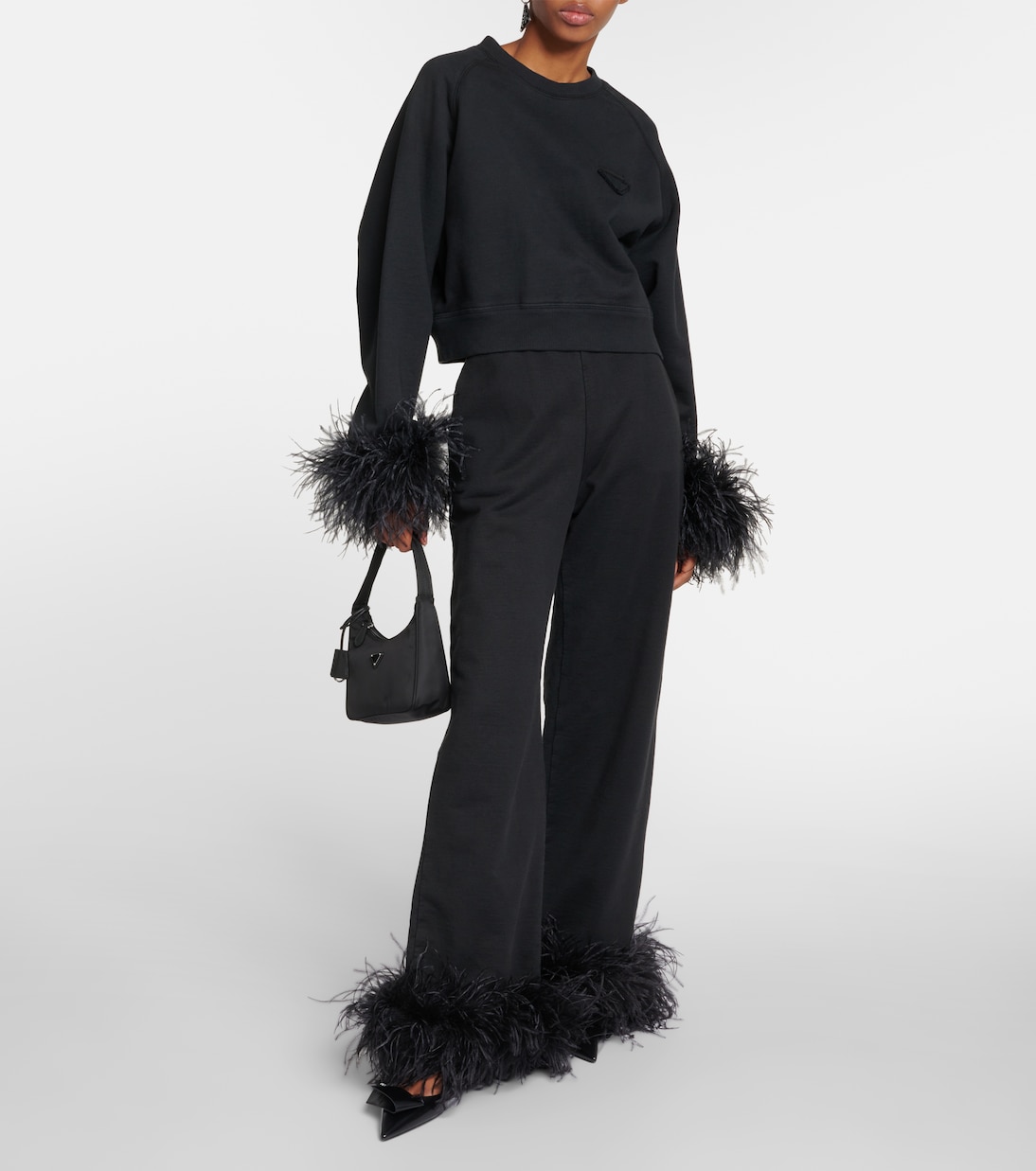 Pantalones deportivos de algodón con plumas | Prada