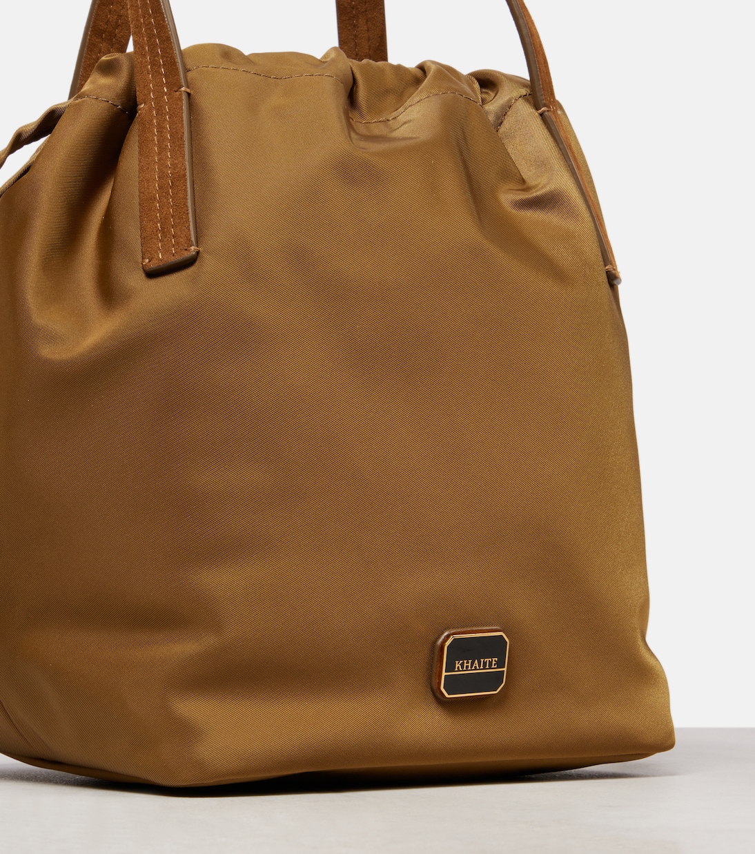 Rory Medium leather-trimmed bucket bag | Khaite