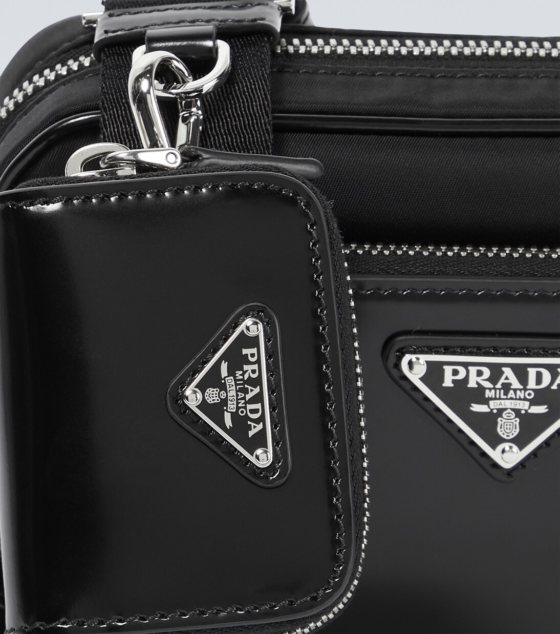 Leather-trimmed crossbody bag | Prada