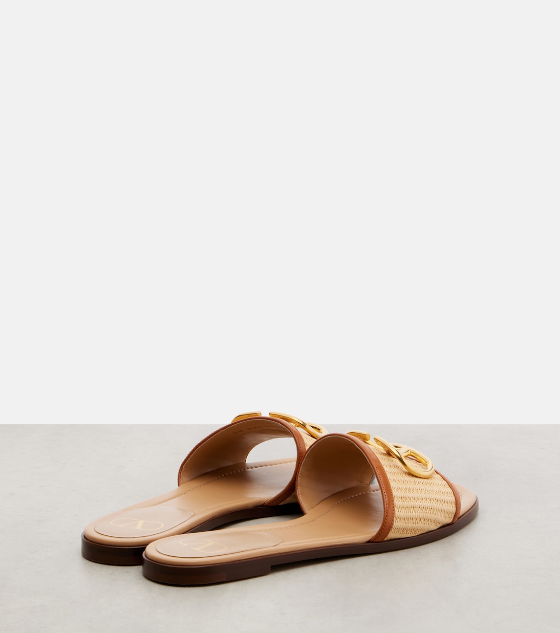 VLogo leather-trimmed raffia slides | Valentino Garavani