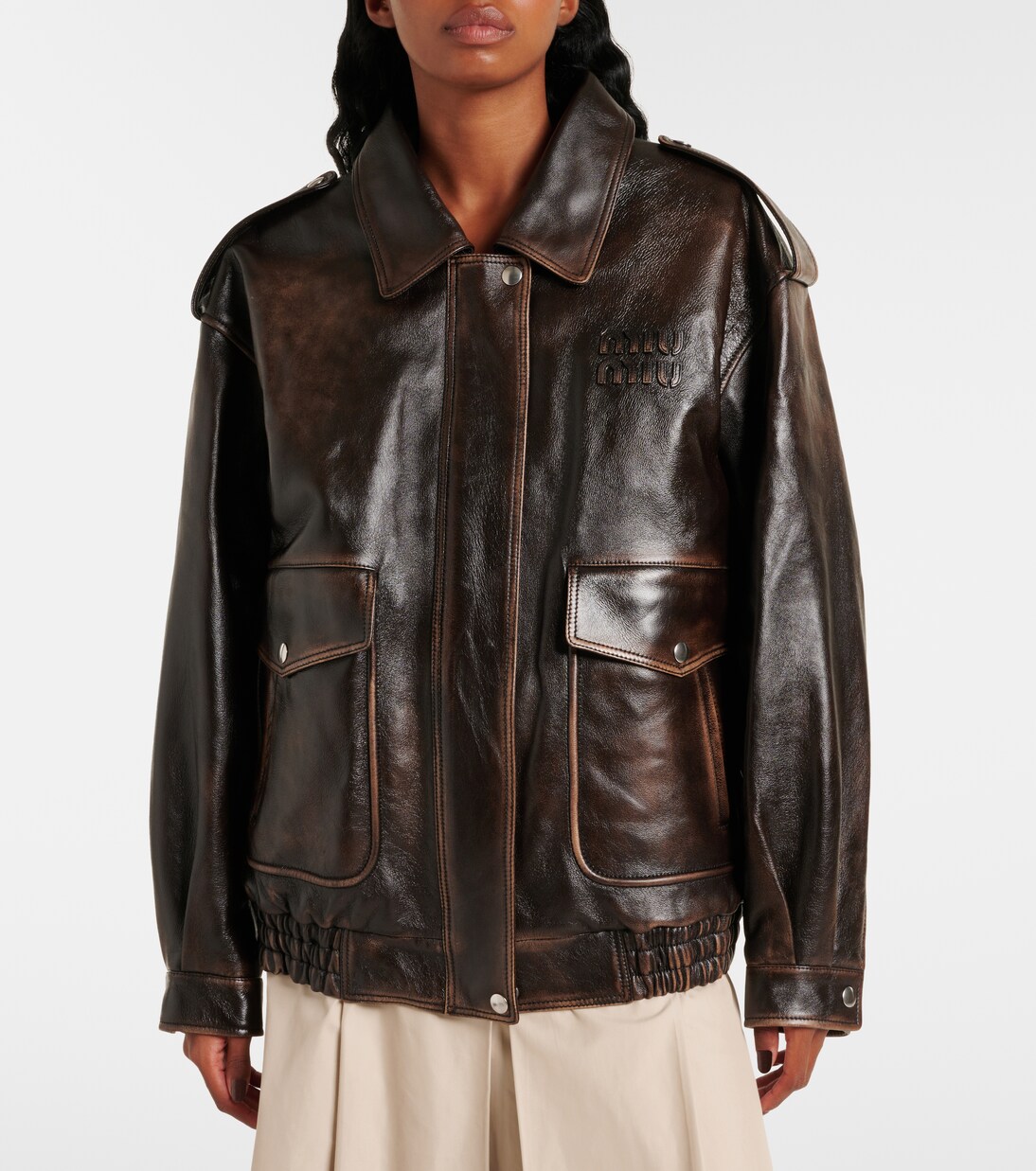 Veste en cuir et shearling à logo | Miu Miu