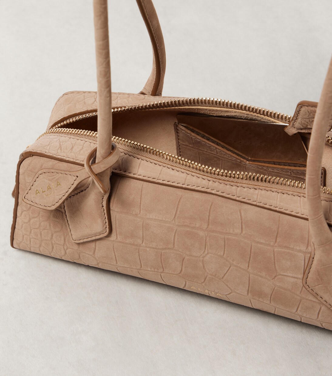 Le Teckel Small croc-effect shoulder bag | Alaïa