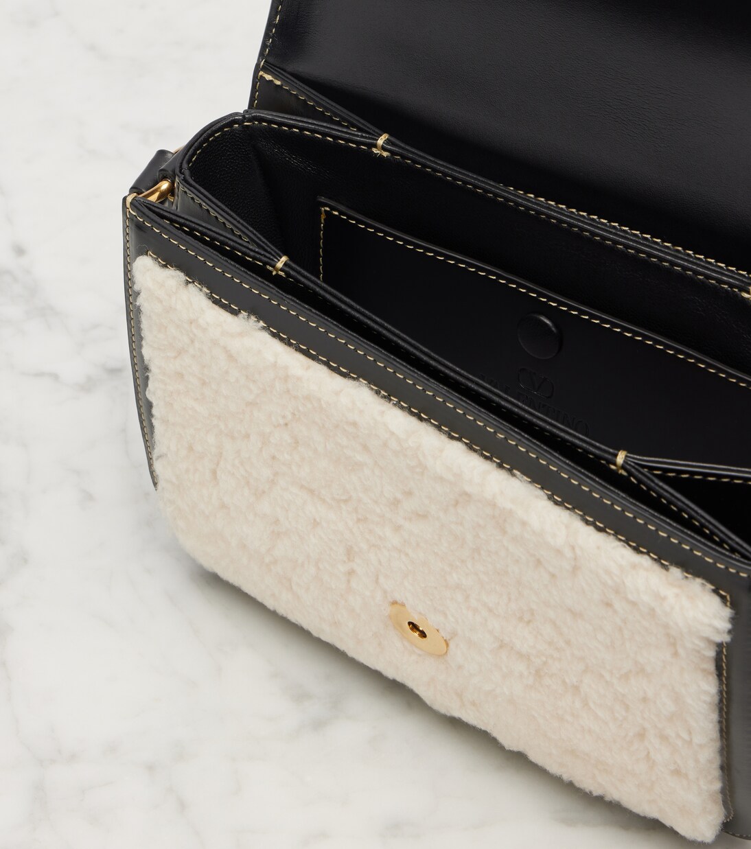 9TO5 shearling and leather shoulder bag | Valentino Garavani