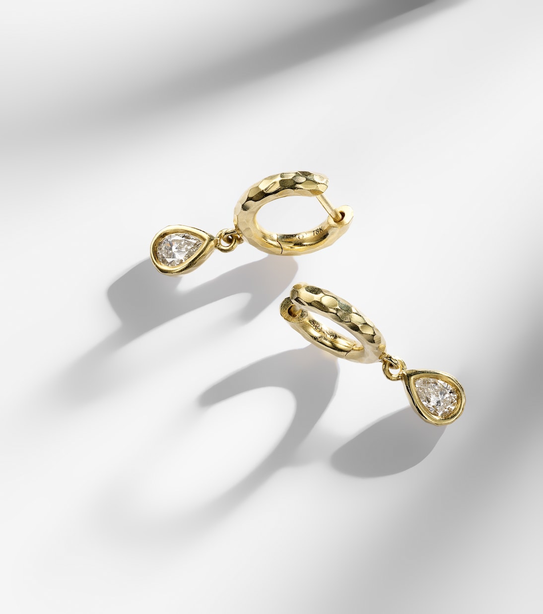 Hidden Gem 18kt gold huggie earrings with diamonds | Octavia Elizabeth