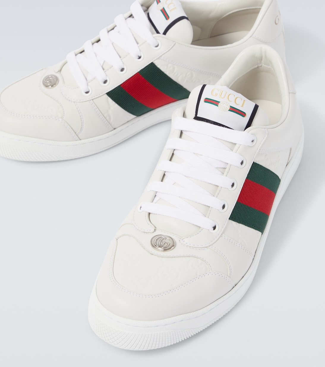 Screener debossed leather sneakers | Gucci