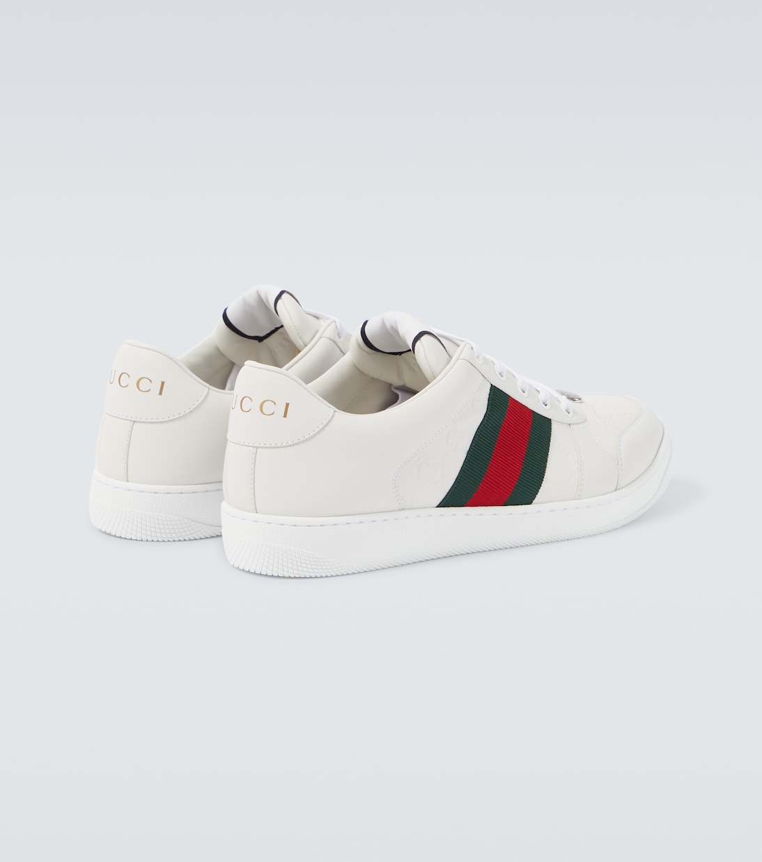 Screener debossed leather sneakers | Gucci