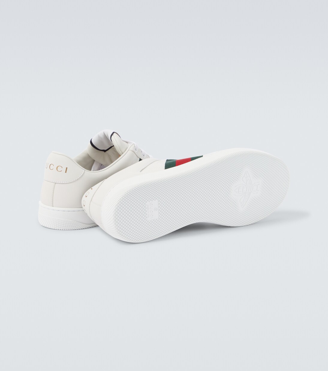 Screener debossed leather sneakers | Gucci