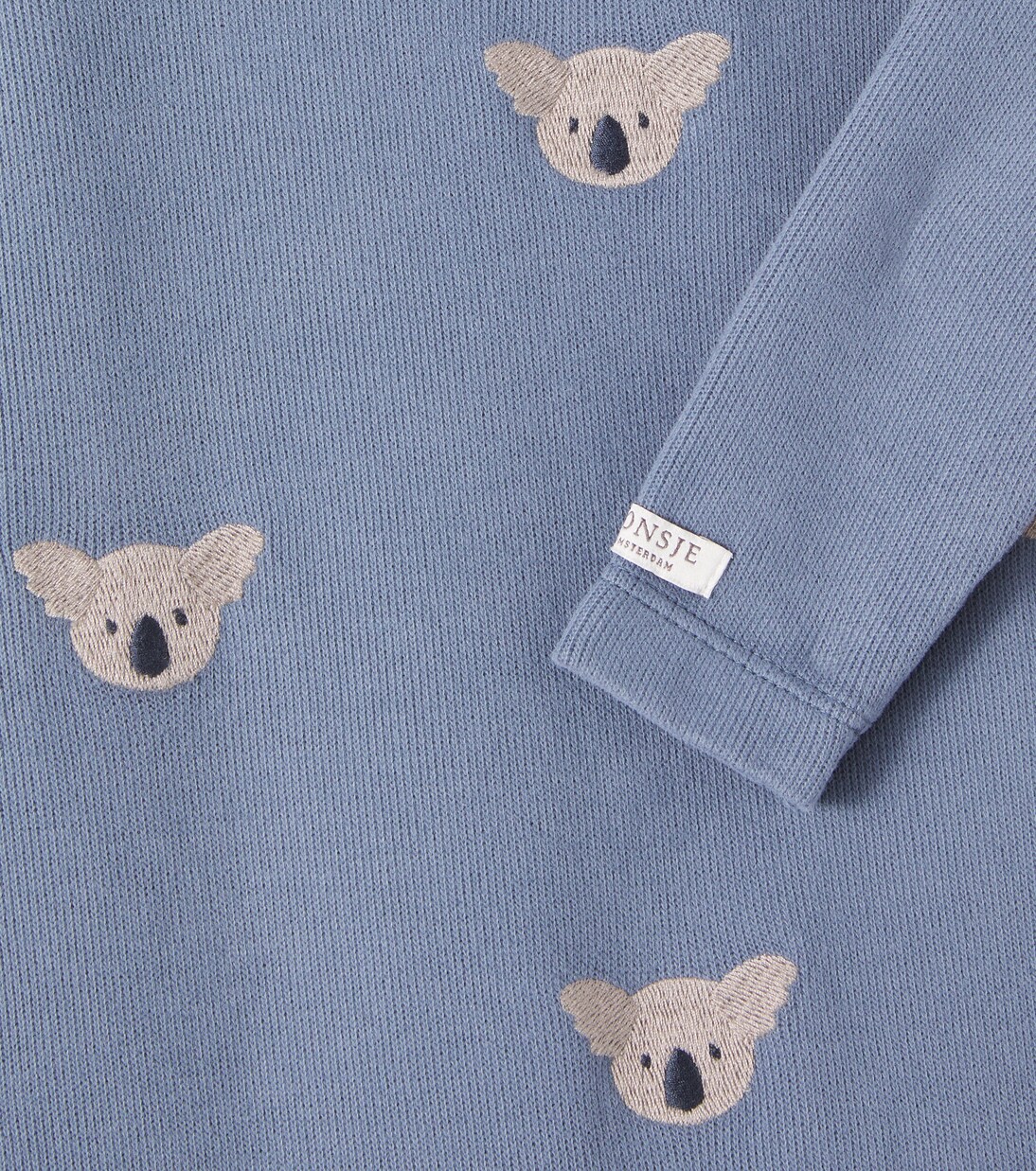 Baby Phlyn embroidered cotton onesie | Donsje