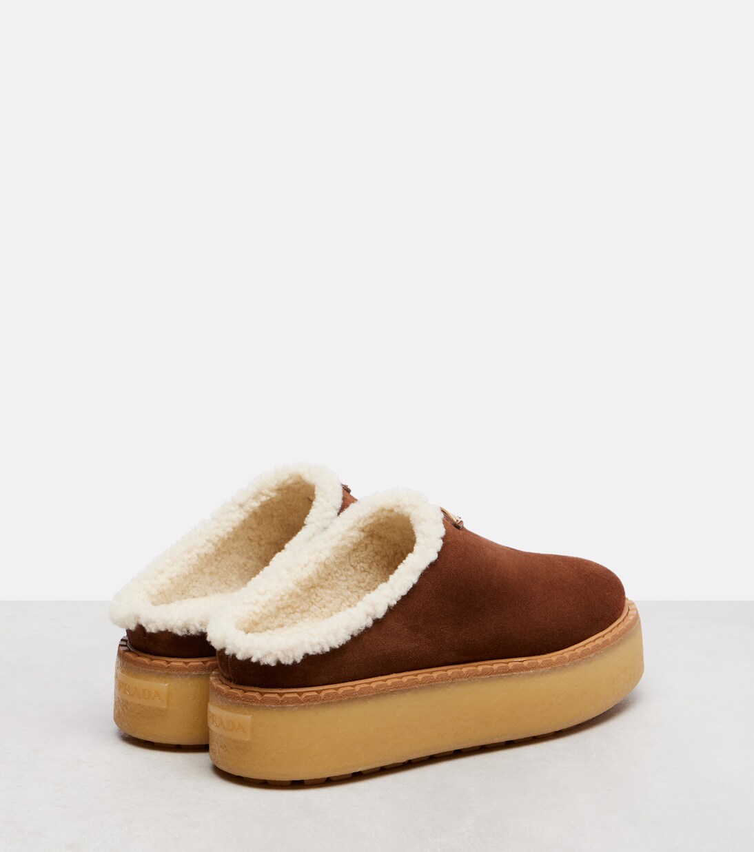 Evolve shearling-trimmed suede platform mules | Prada