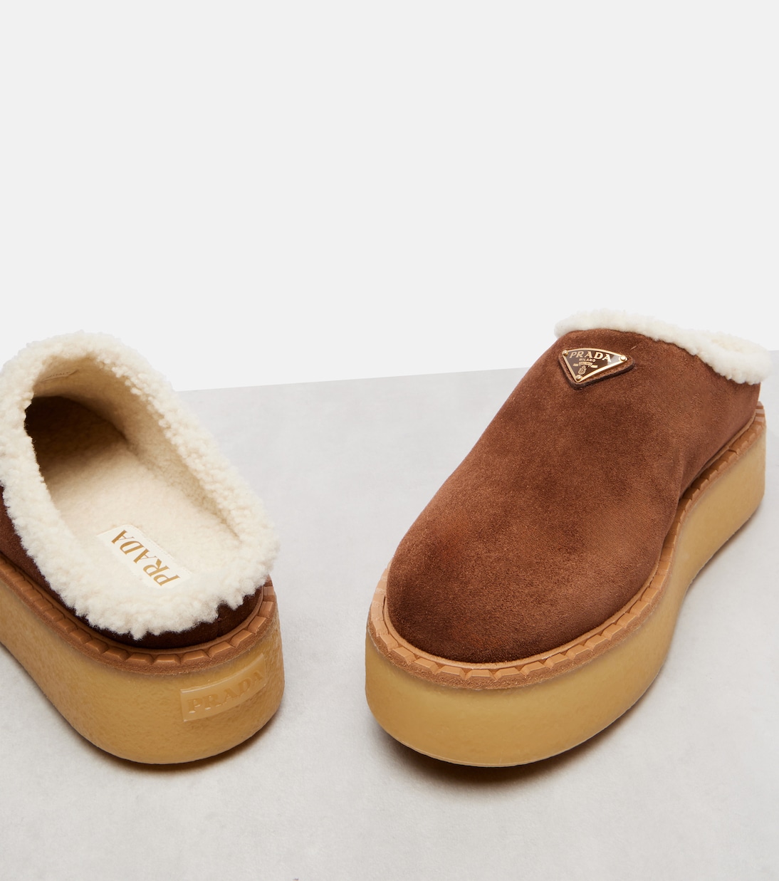 Evolve shearling-trimmed suede platform mules | Prada