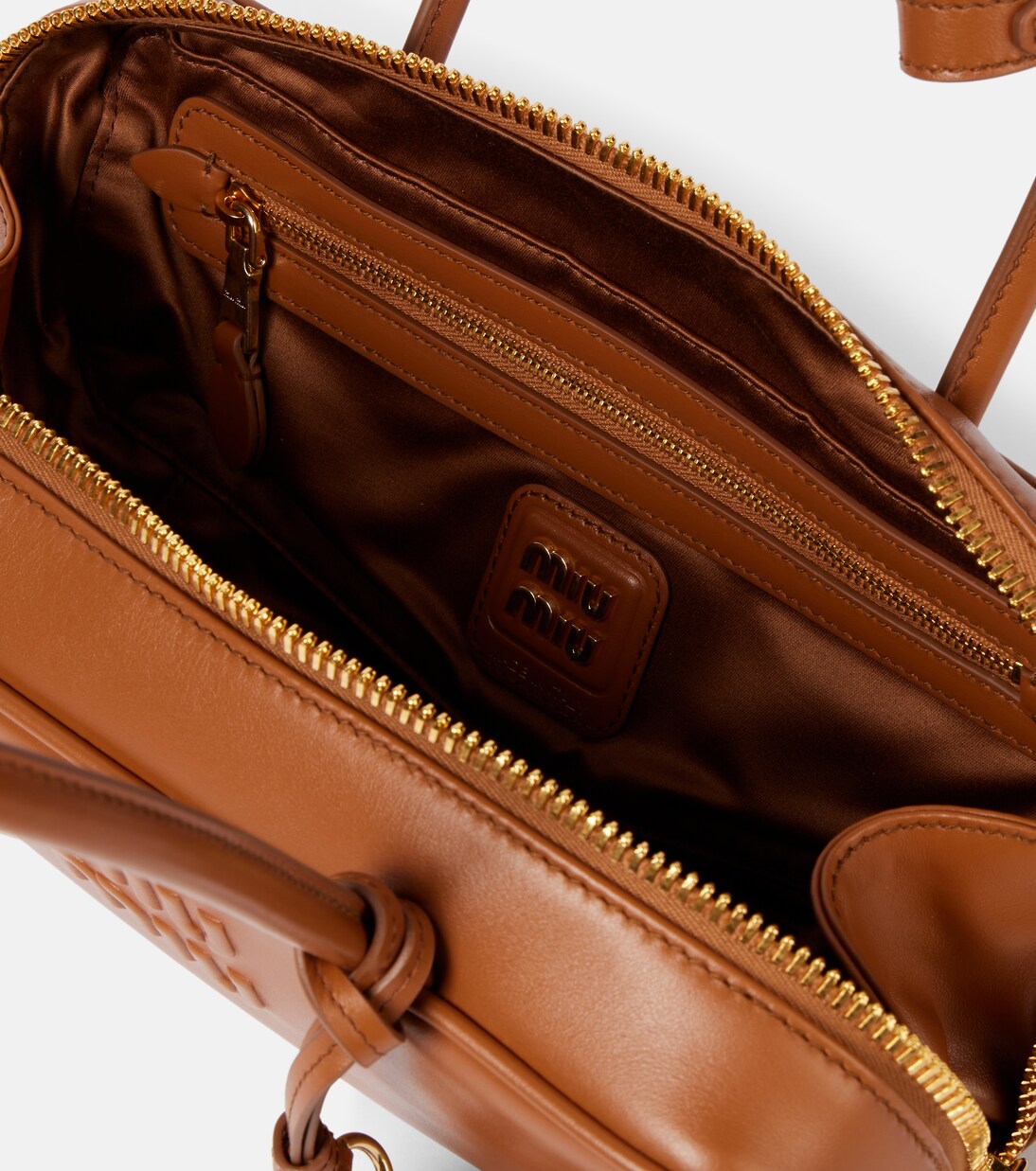 Beau logo embossed leather tote bag | Miu Miu