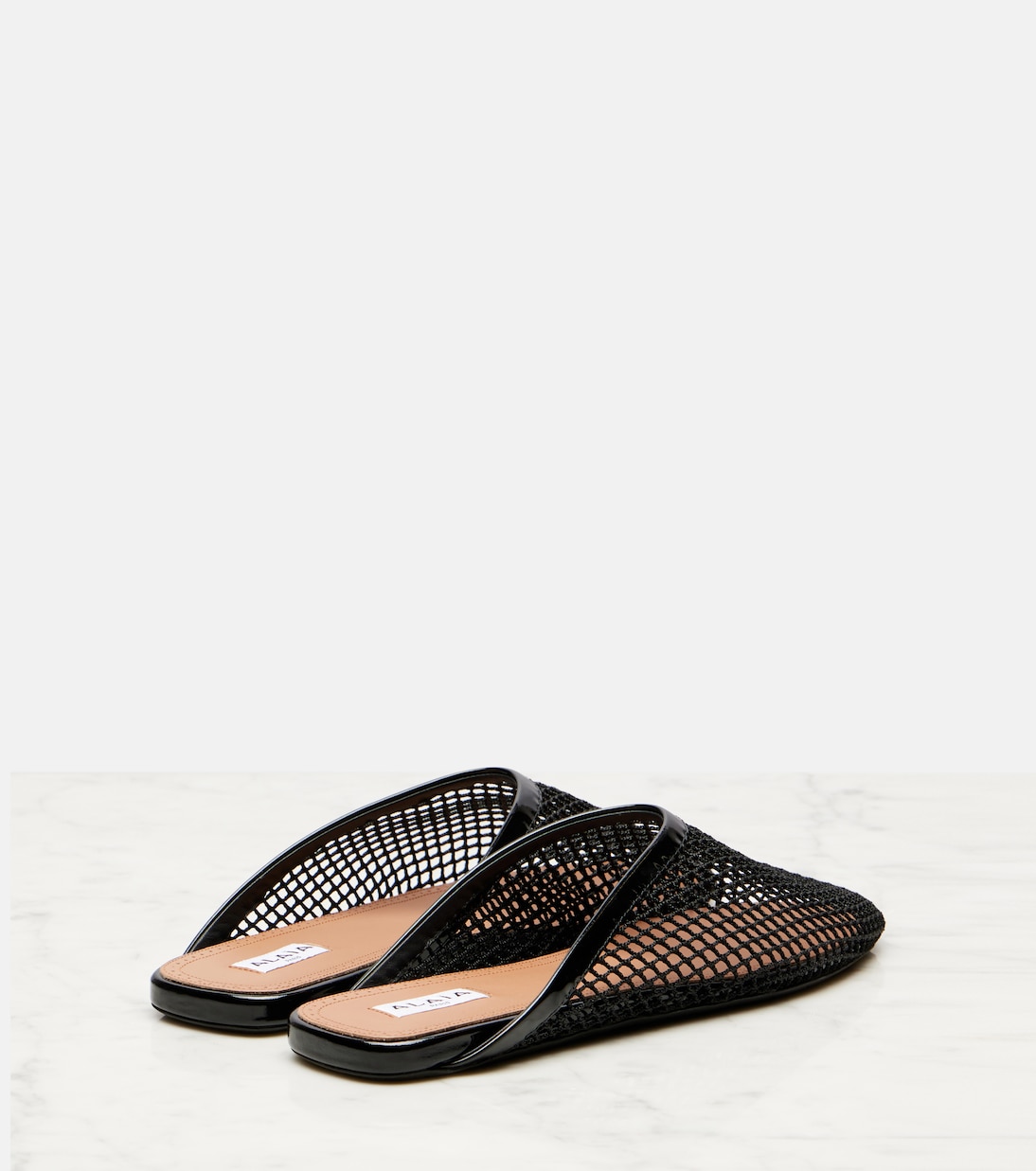 Patent leather-trimmed fishnet mules | Alaïa