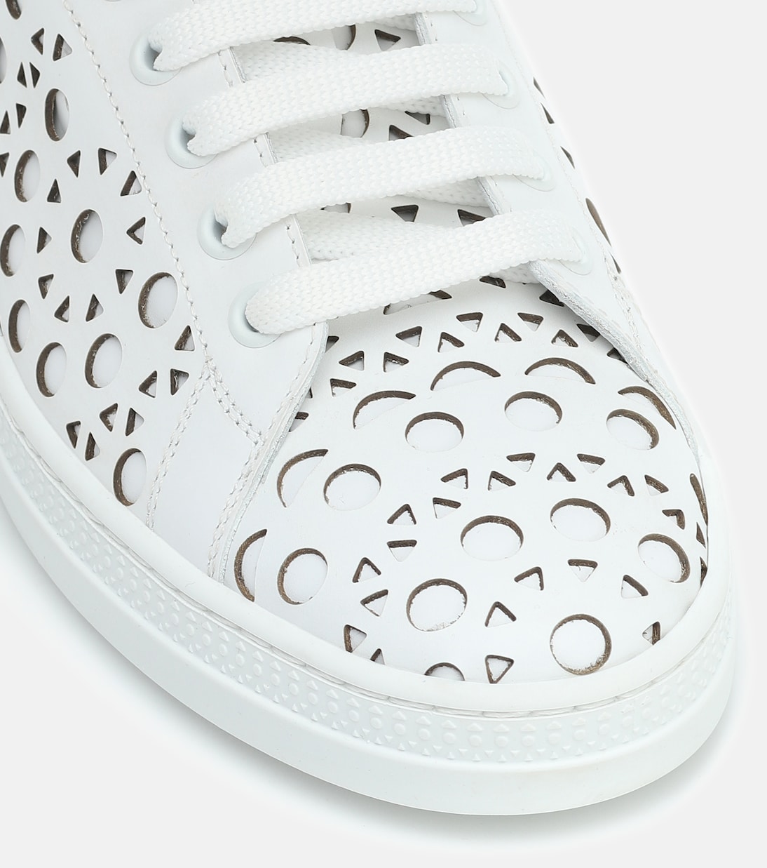 Laser-cut leather sneakers | Alaïa