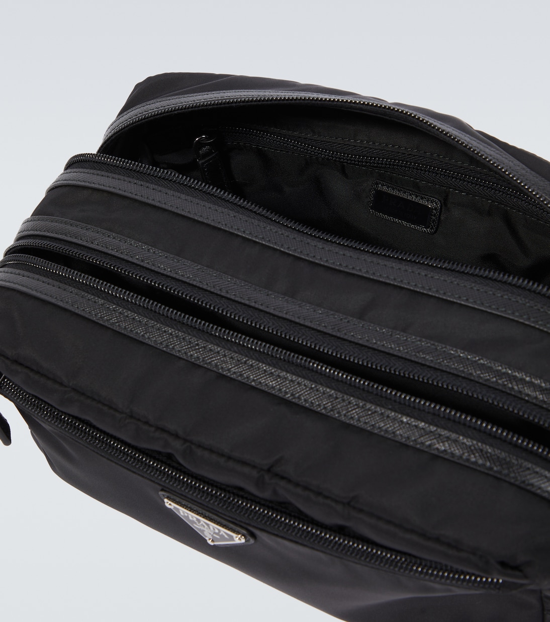 Re-Nylon leather-trimmed travel bag | Prada