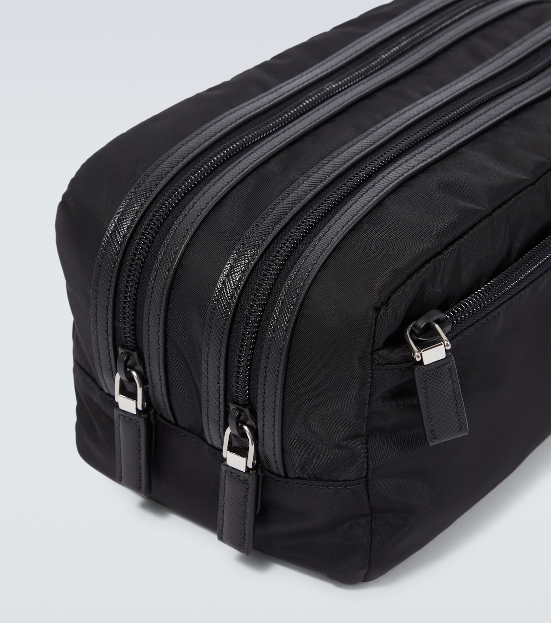 Re-Nylon leather-trimmed travel bag | Prada