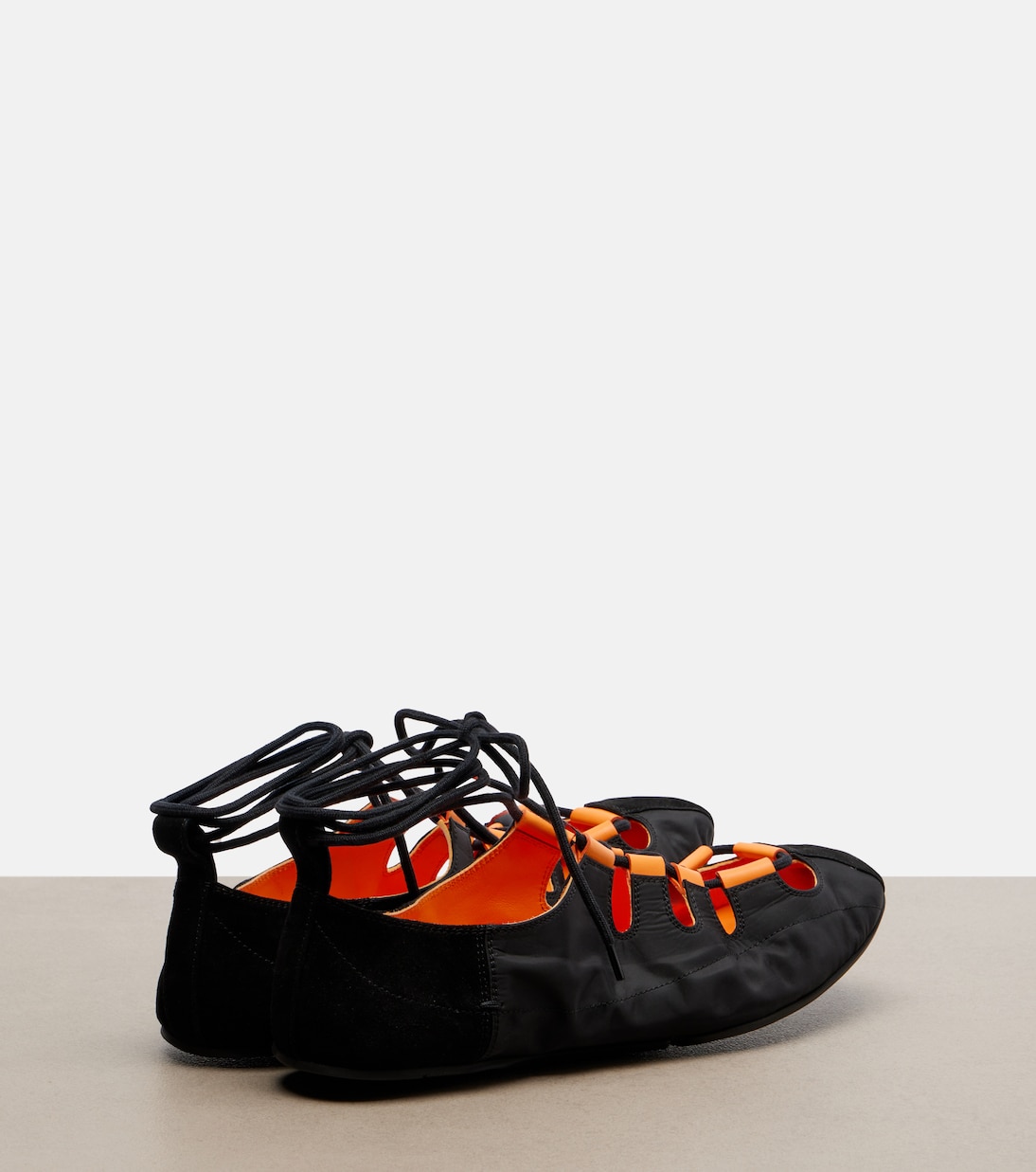 Suede-trimmed lace-up ballet flats | Alaïa
