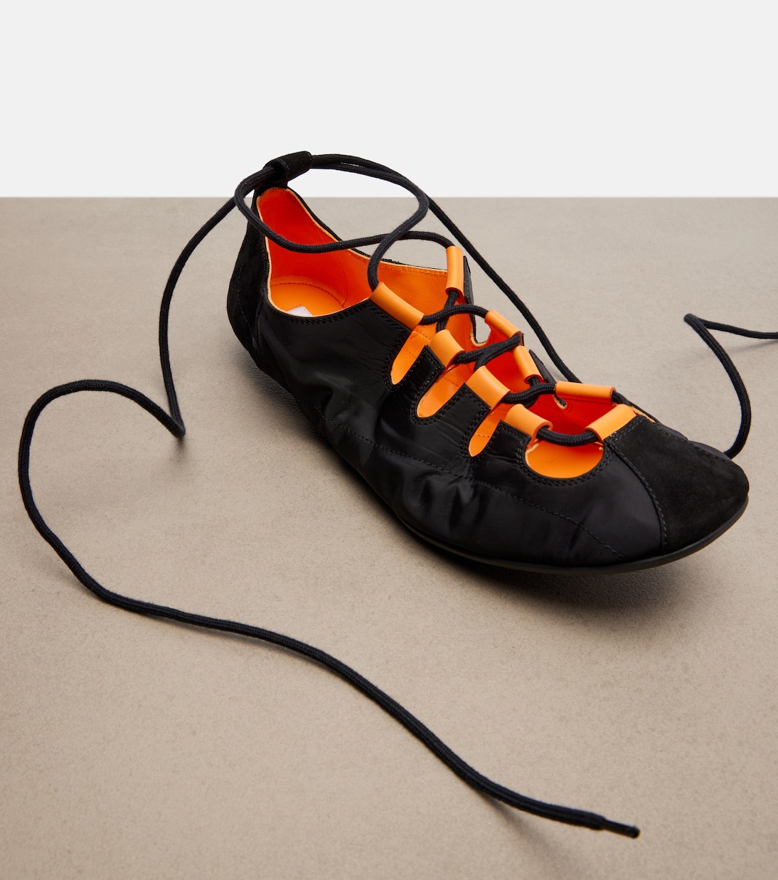 Suede-trimmed lace-up ballet flats | Alaïa