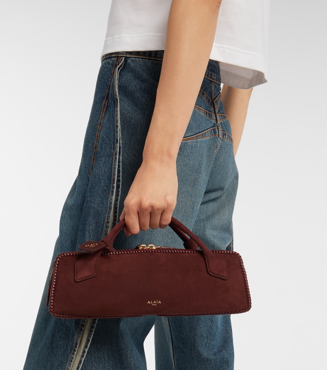 Le Teckel Small suede clutch | Alaïa