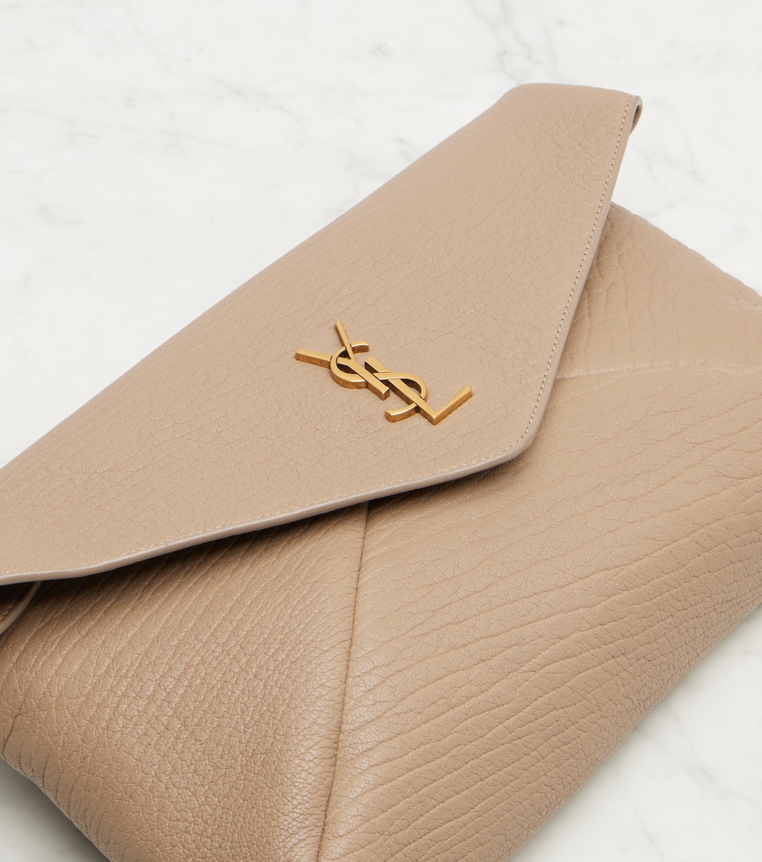 Cassandre Large leather clutch | Saint Laurent