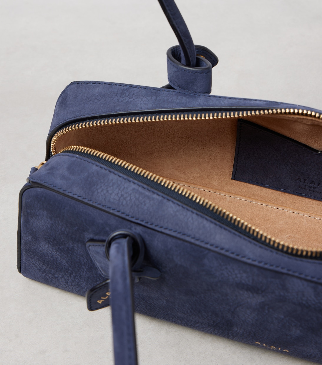 Le Teckel suede shoulder bag | Alaïa