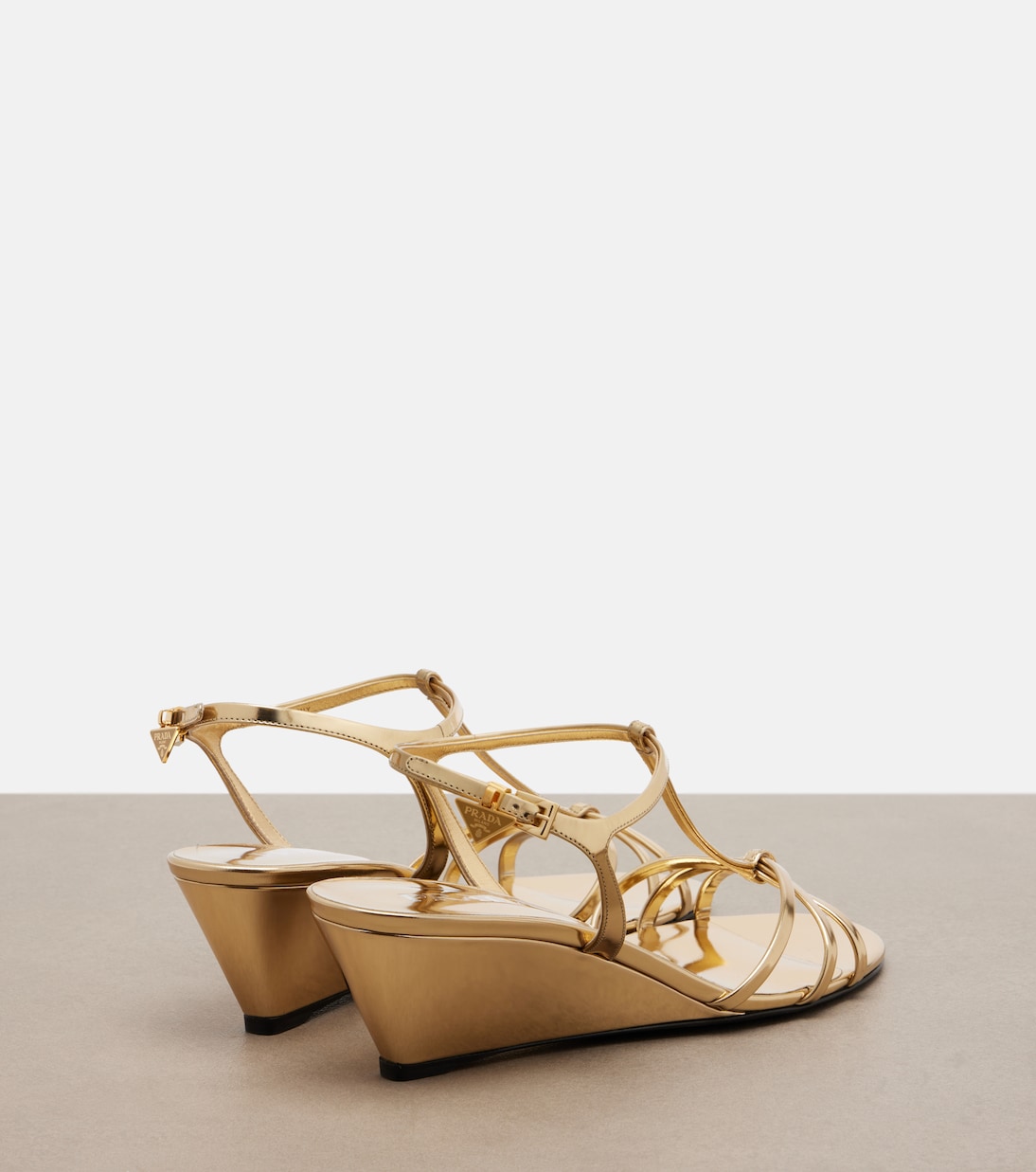 Metallic leather wedge sandals | Prada