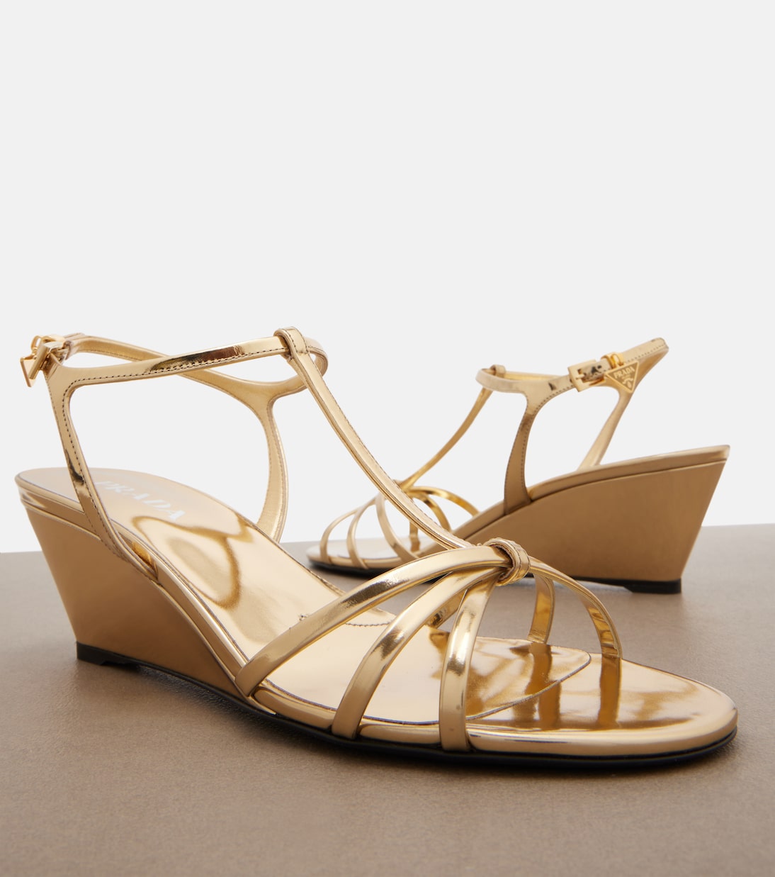 Metallic leather wedge sandals | Prada