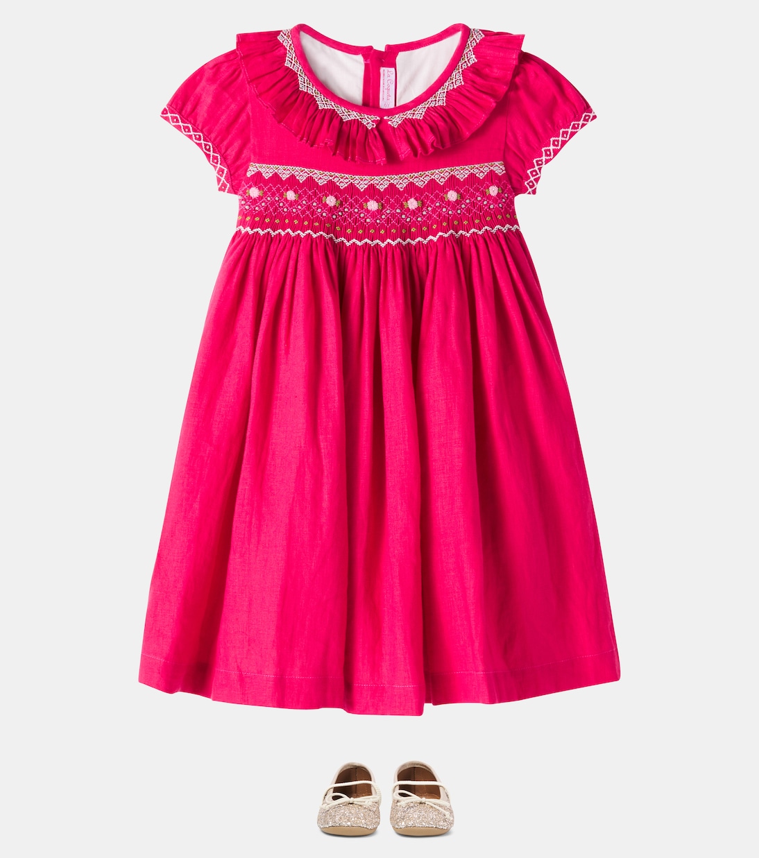 Embroidered smocked linen dress | La Coqueta