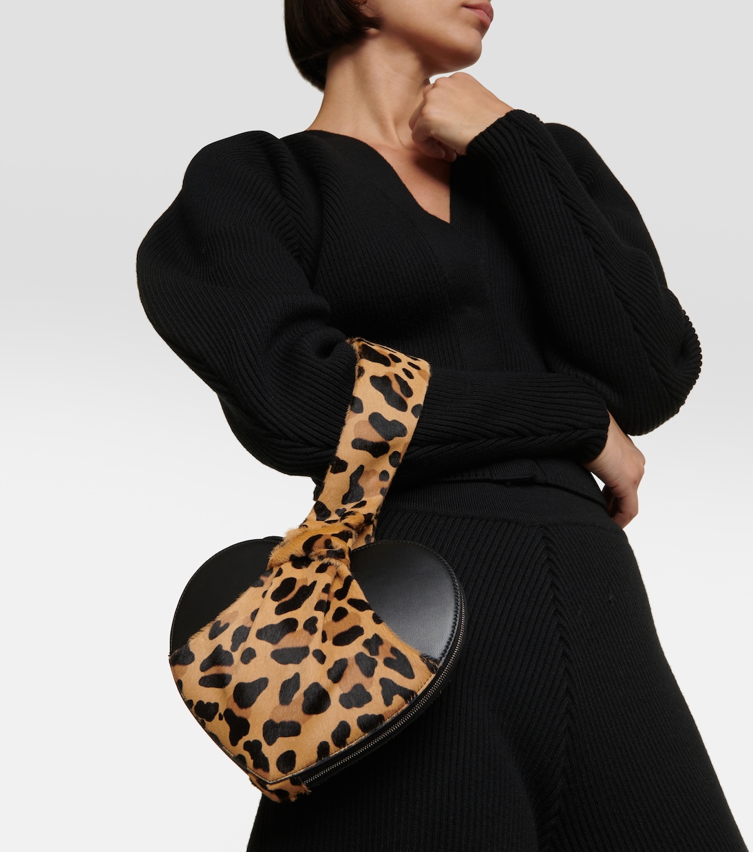 Le Cache Cœur calf hair and leather clutch | Alaïa