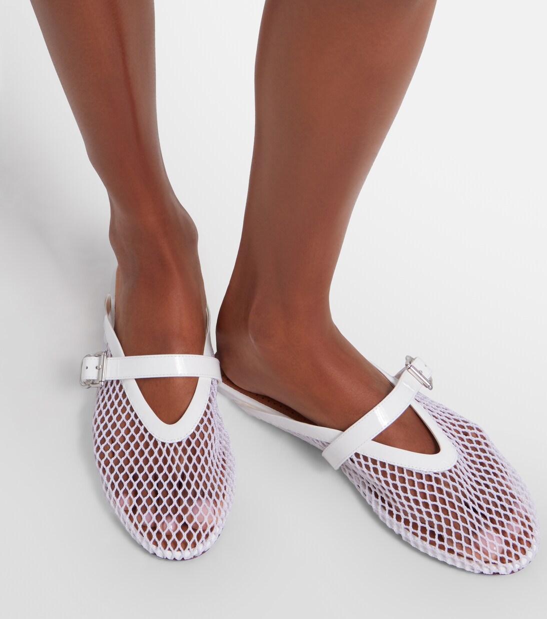 Fishnet leather-trimmed slip-on mules | Alaïa