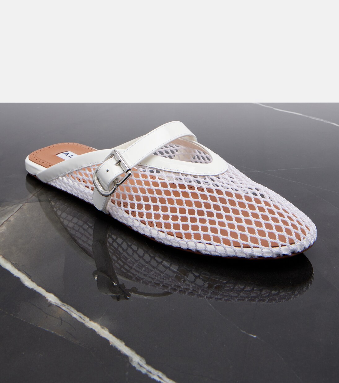 Fishnet leather-trimmed slip-on mules | Alaïa